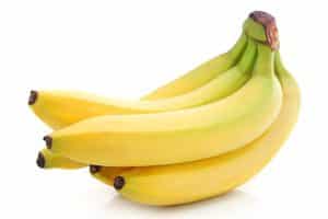 ветка бананов на белом фоне